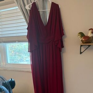 Long formal dress with leg slit.